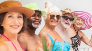 elderly people at the beach smiling